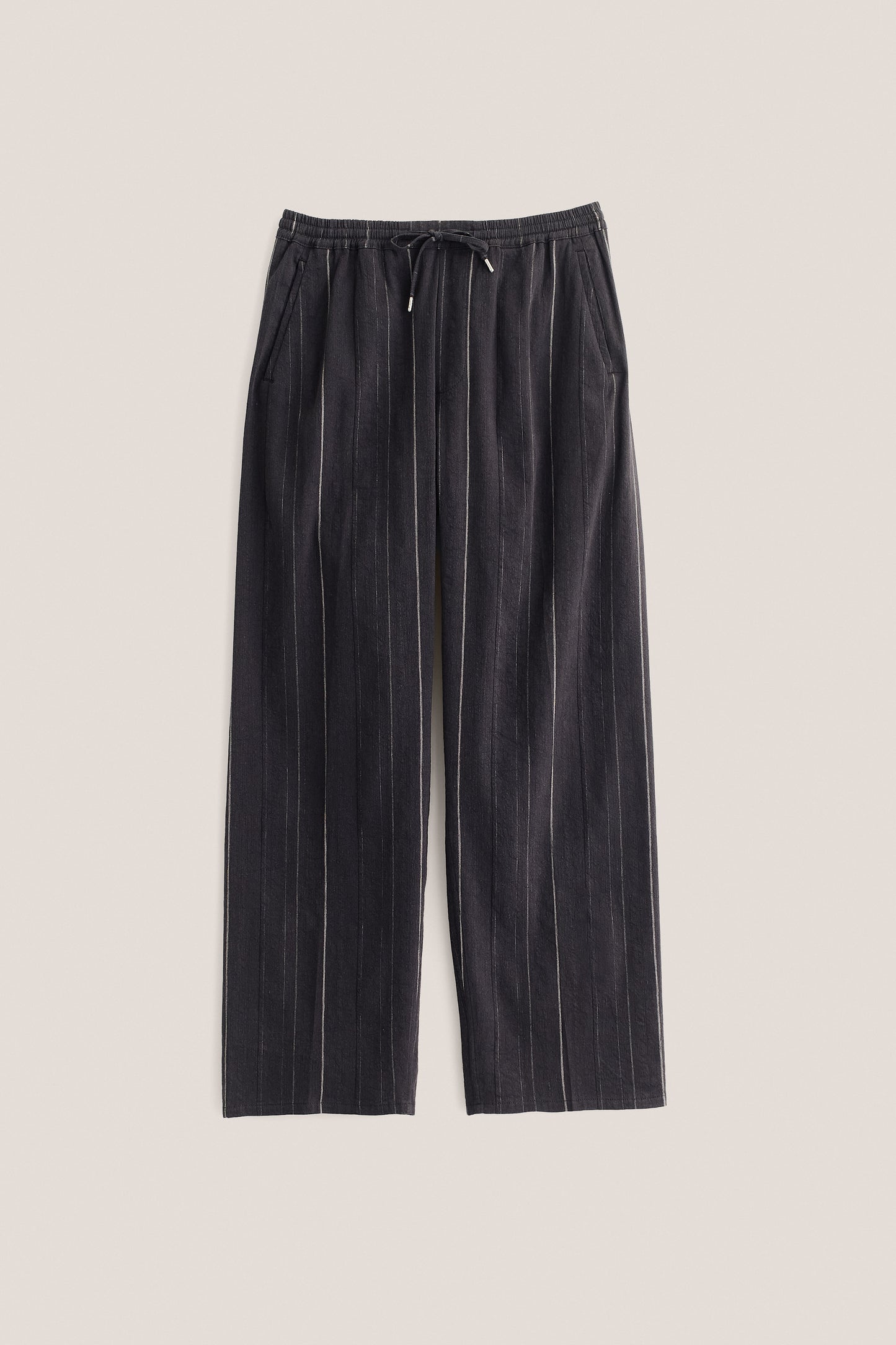 Men's long pants, black cotton-linen blend with subtle white stripes, elasticated waistband, and wide straight fit.