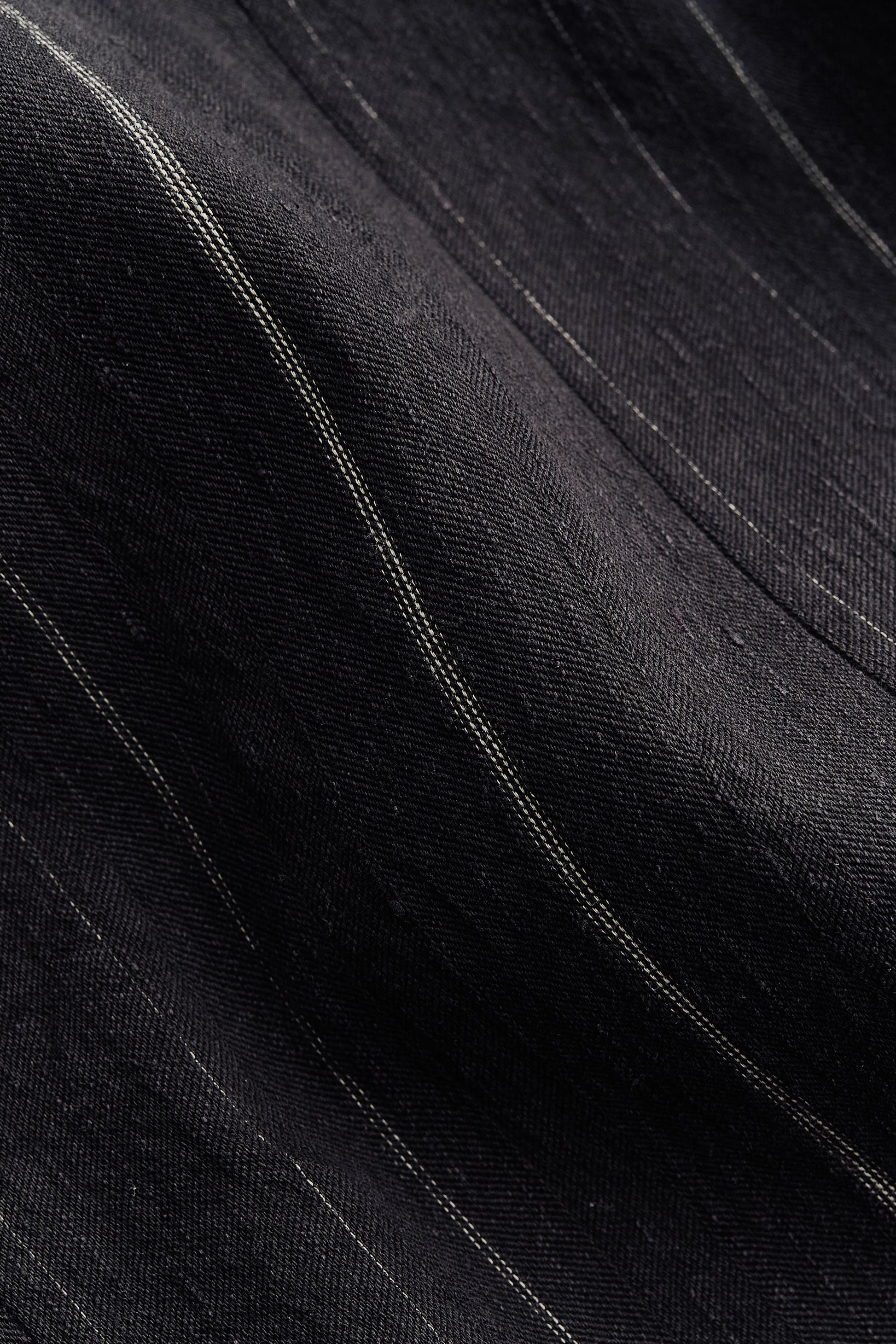 Men's long pants, cotton linen blend, faded black with subtle white stripes.