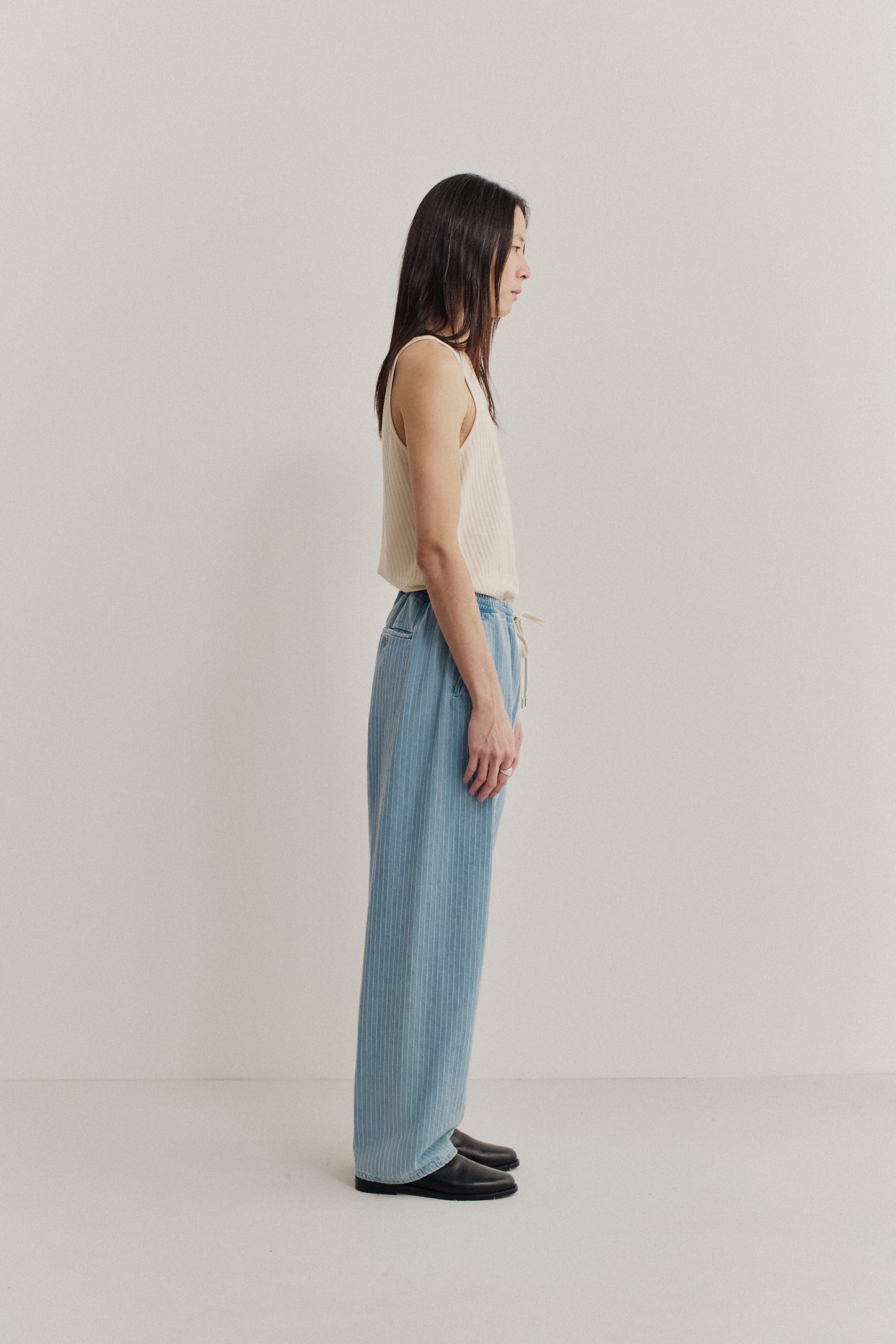 Men's long-pants, organic cotton, washed light blue denim with subtle white pinstripes, elasticated waistband.
