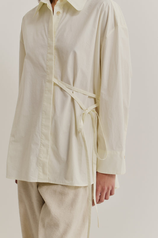 Women's long-sleeved shirt, organic cotton, garment washed, off-white, with side tie detail.
