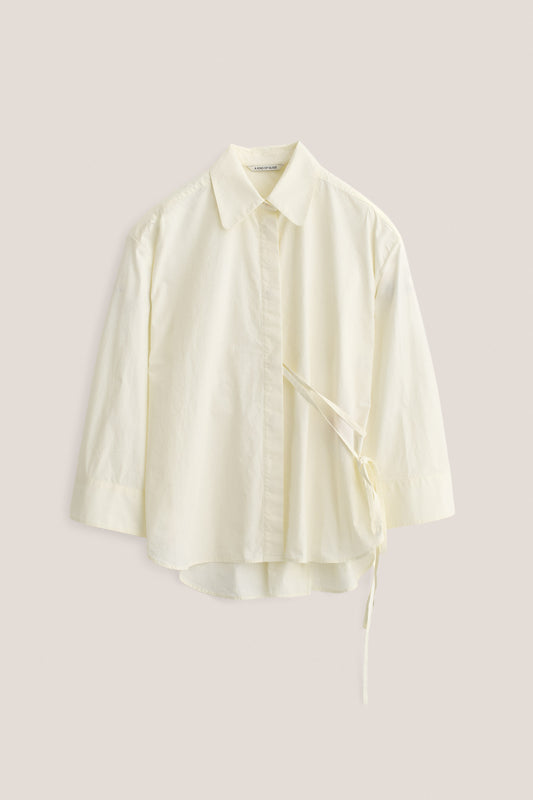 Women's long-sleeved shirt, organic cotton, garment washed, off-white, with wide oversized fit and side tie detail.