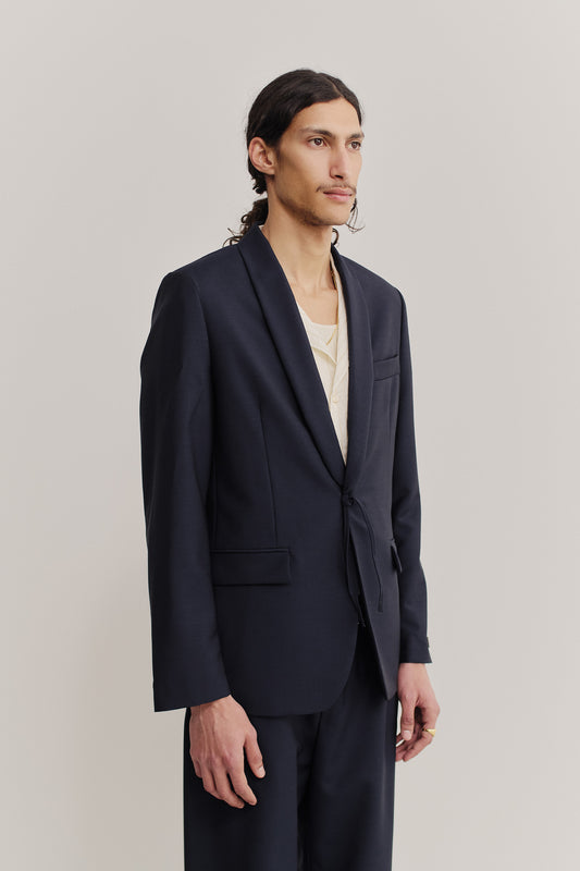 Men's tailoring blazer, virgin wool, dark navy, with shawl collar and kimono-inspired cord closure.