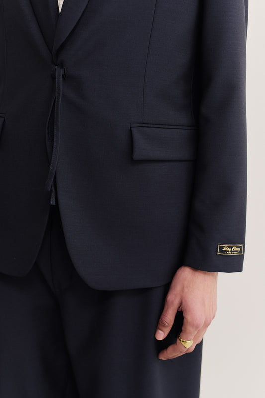 Men's tailoring blazer, 100% virgin wool, dark navy, with shawl collar, flap pocket, and gold "stay classy" label.