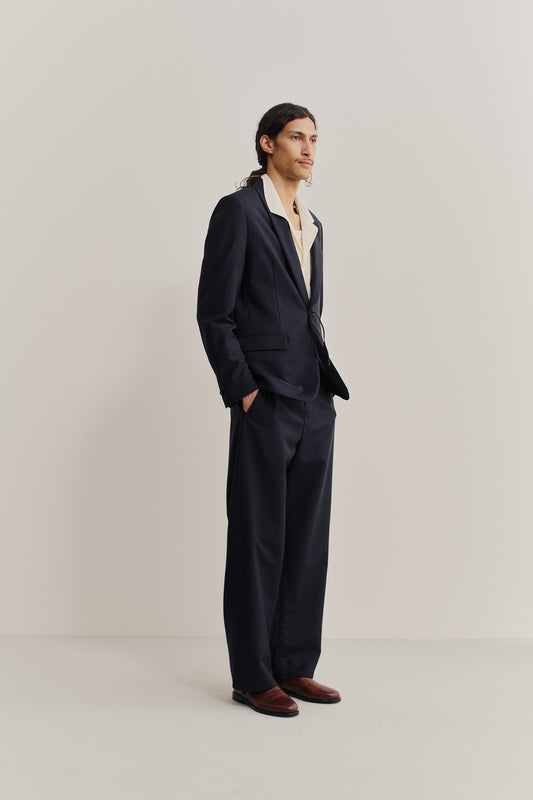 Men's tailoring blazer, virgin wool, dark navy, with shawl collar and kimono-inspired cord closure.