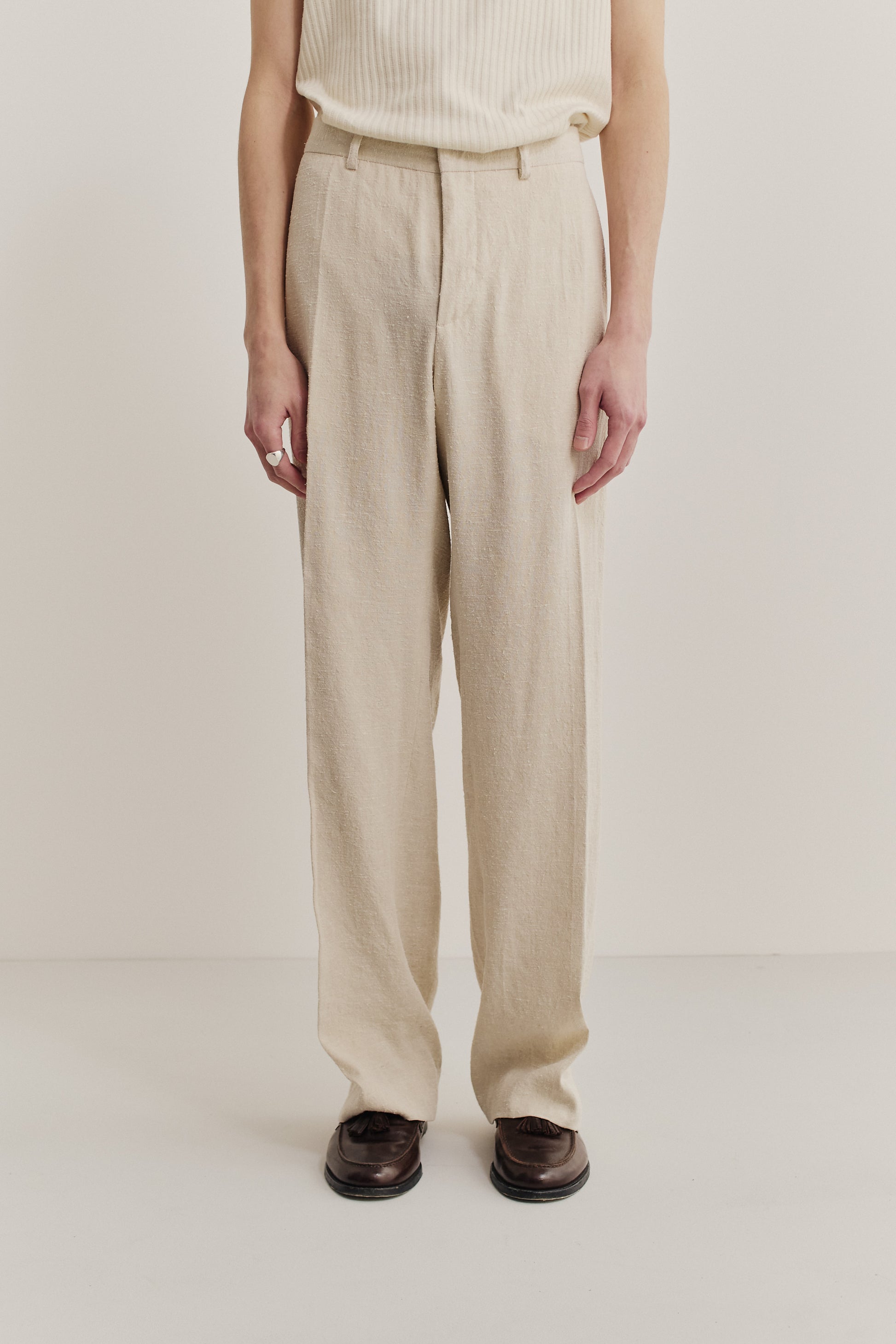 Men's long-pants, linen-silk blend, naturally textured, undyed beige, tailored wide-leg cut with pressed pleats.