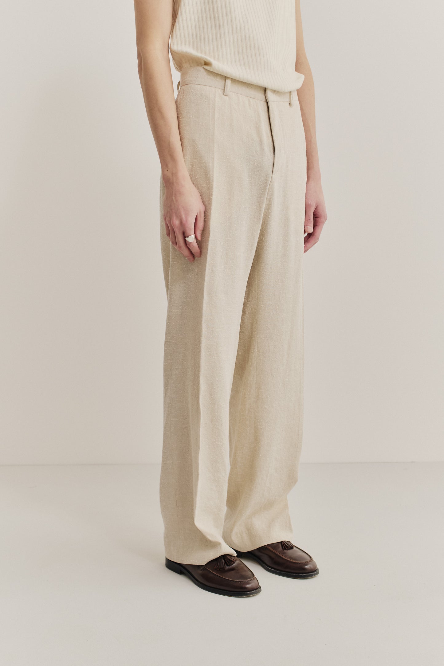 Men's long-pants, linen-silk blend, naturally textured, undyed beige, tailored wide-leg with pressed pleat.