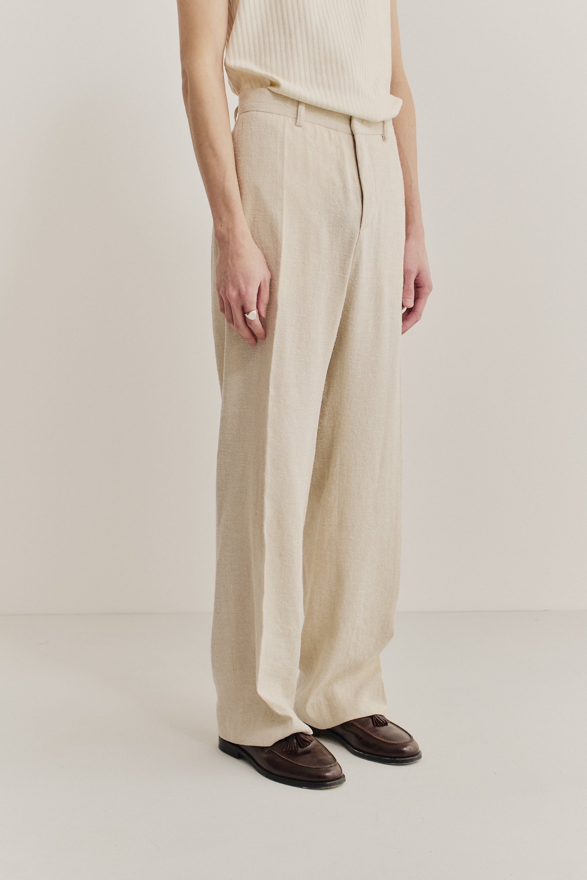 Men's long-pants, linen-silk blend, naturally textured, undyed beige, tailored wide-leg with pressed pleat.