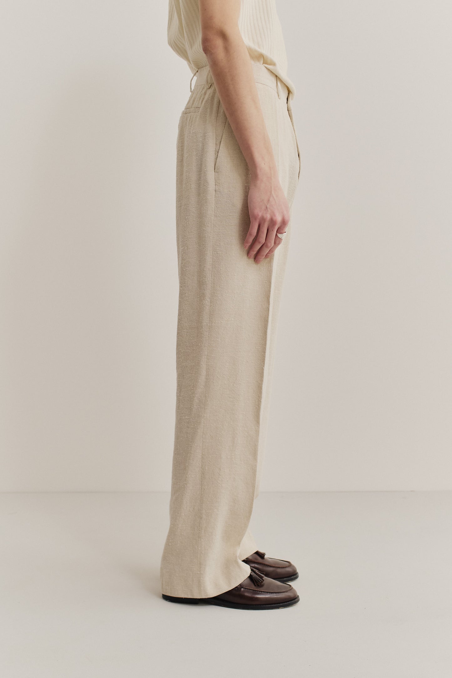 Men's long-pants, linen-silk blend, naturally textured, undyed beige, tailored wide-leg with pressed pleat.
