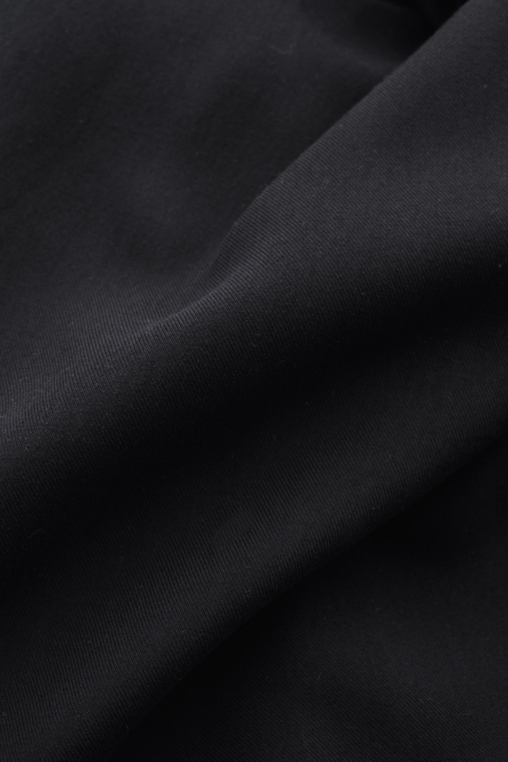 Men's long-pants, 100% lyocell heavy twill, deep black, fluid drape with soft hand feel.