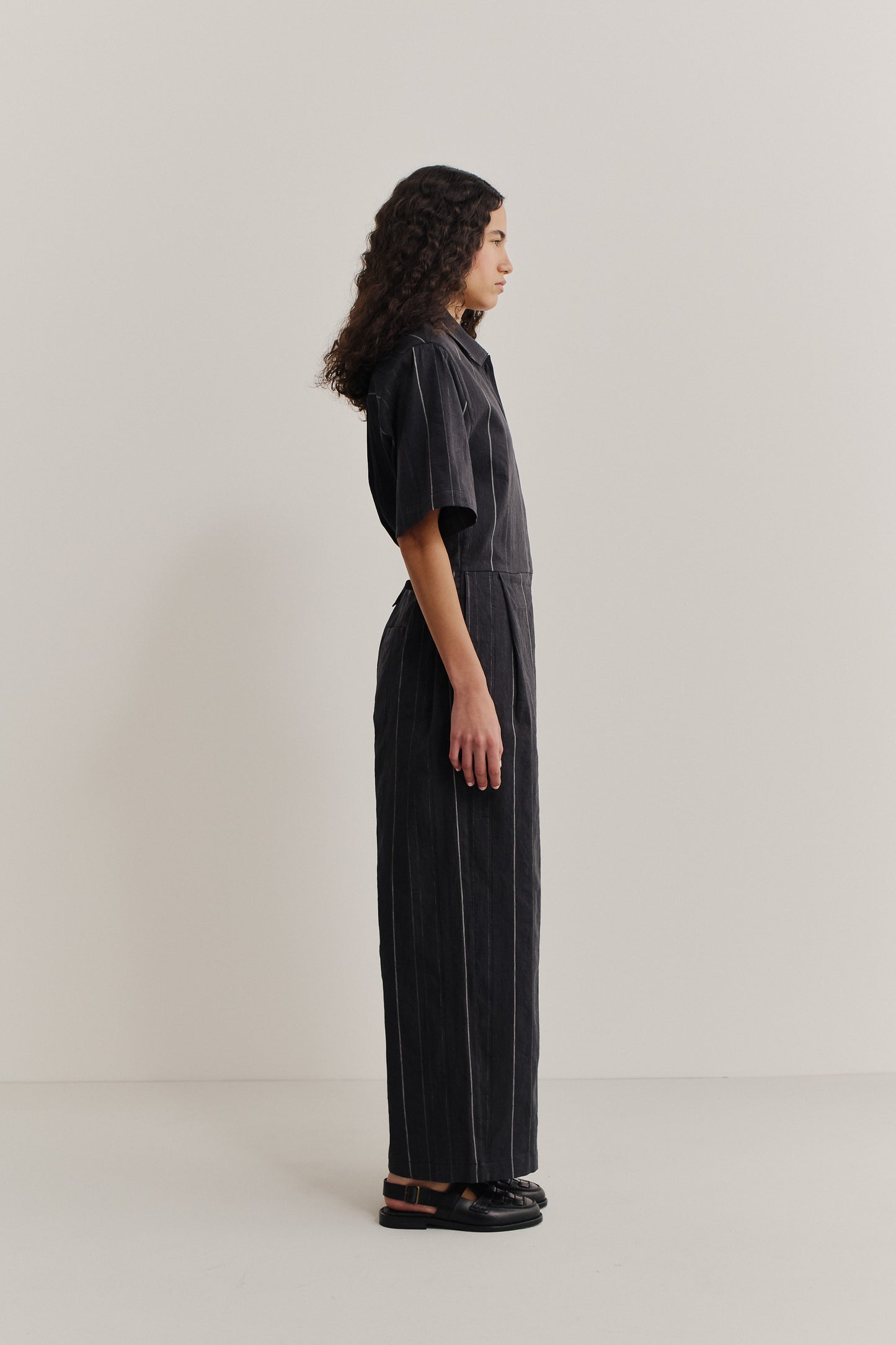 Women's short-sleeved jumpsuit, cotton-linen blend, faded black with white stripes, lay-down collar, wide leg.
