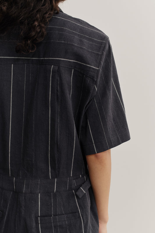 Women's jumpsuit, short-sleeved, cotton-linen blend, faded black with white stripes, workwear style.