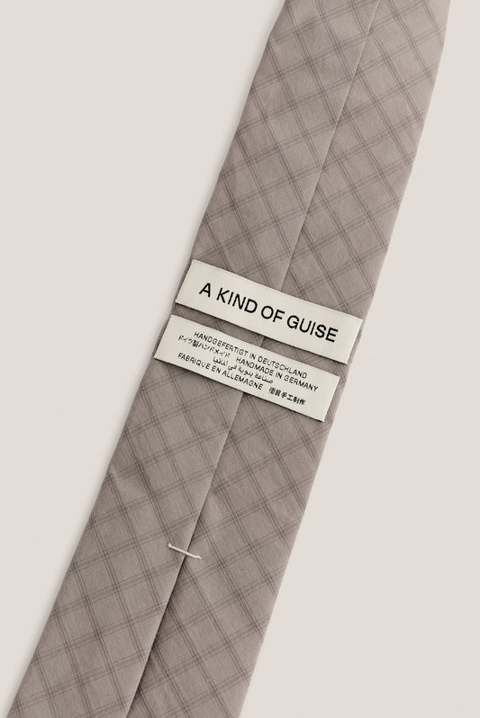 Men's accessories tie, 100% organic cotton, light grey with dark grey squared check pattern.