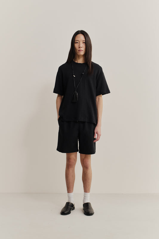 Men's shorts, black cotton blend with irregular wavy stripes, elastic waist, side pockets.